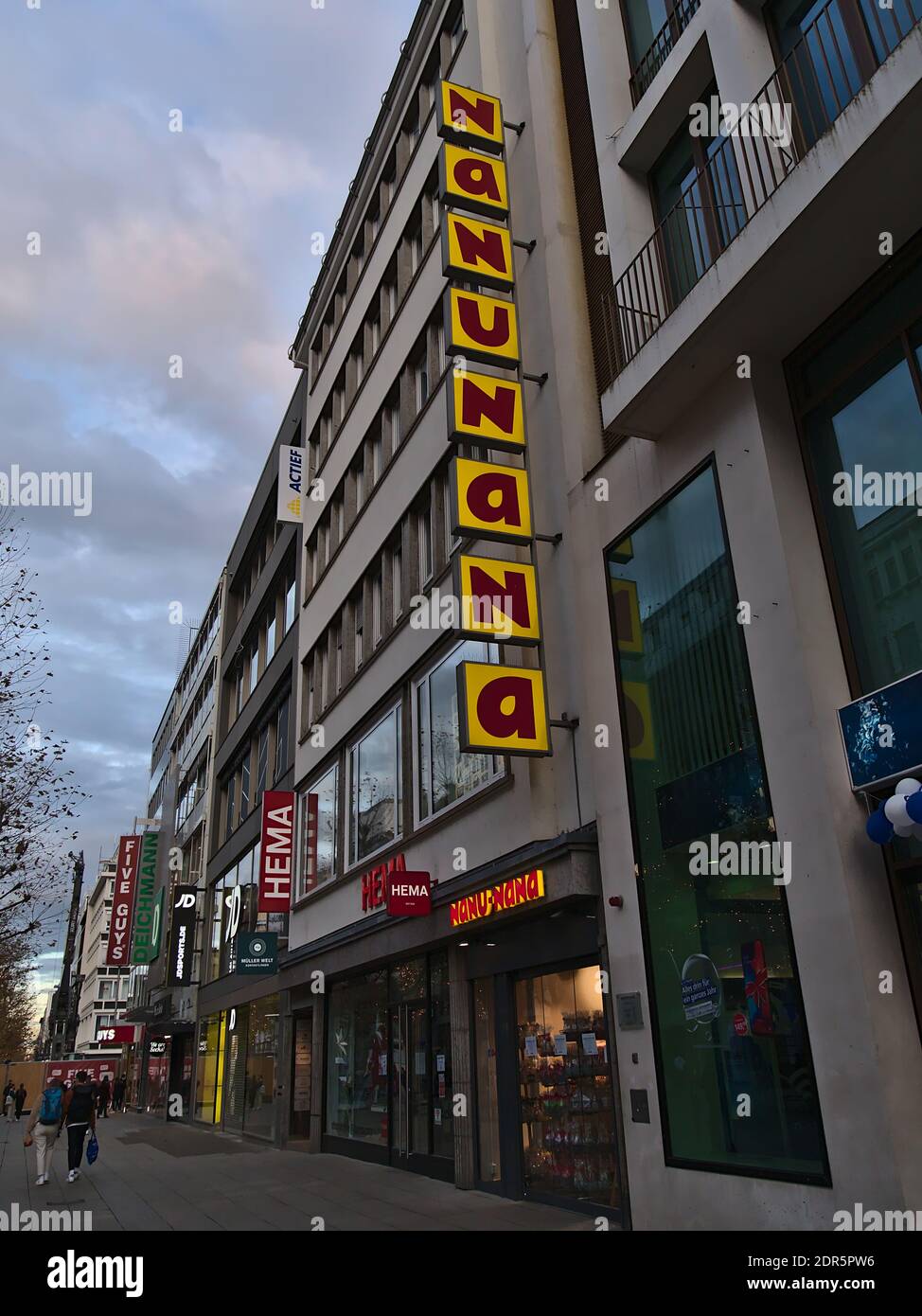 Popular shopping street Königstraße in downtown with closed shops during coronavirus lockdown including branches of Nanu-Nana (focus), Hema, JD Sports. Stock Photo