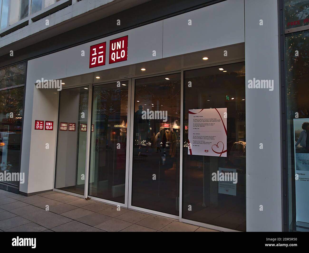Entrance of closed shop of clothing retail company UNIQLO in shopping  street Königstraße during Covid-19 lockdown with sign informing about  closing Stock Photo - Alamy