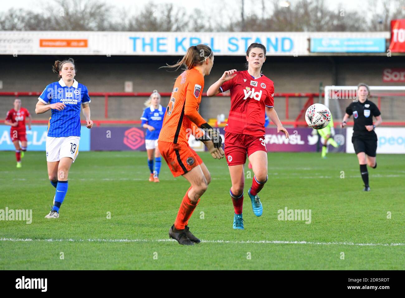 Crawley, UK. 20th Dec, 2020. Emma Harries of Reading charges down on Cecilie Fiskerstrand Goalkeeper of Brighton & Hove Albion during the FA Women's Super League match between Brighton & Hove Albion Women and Reading at The People's Pension Stadium on December 20th 2020 in Crawley, United Kingdom. (Photo by Jeff Mood/phcimages.com) Credit: PHC Images/Alamy Live News Stock Photo