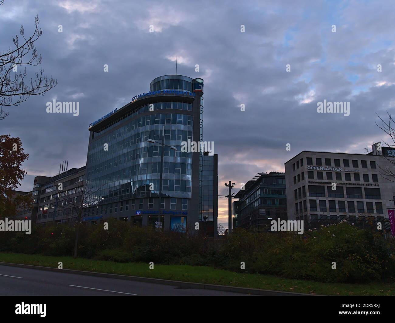 Modern office building of regional cooperative bank Stuttgarter Volksbank offering financial and investment services in downtown in evening. Stock Photo