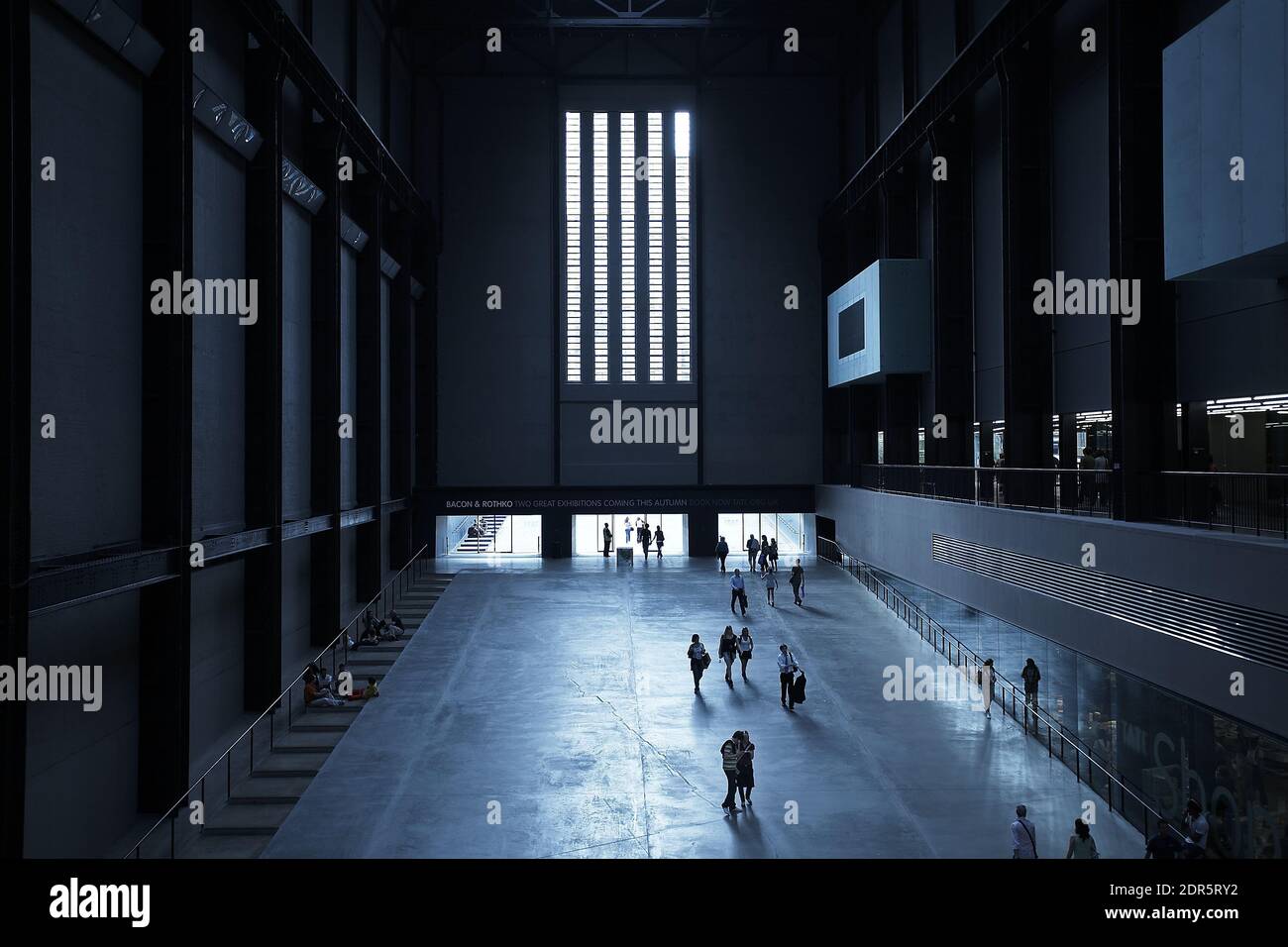 Visitors on the entrance ramp to the the vast Turbine Hall at Tate Modern, Bankside, London, UK Stock Photo