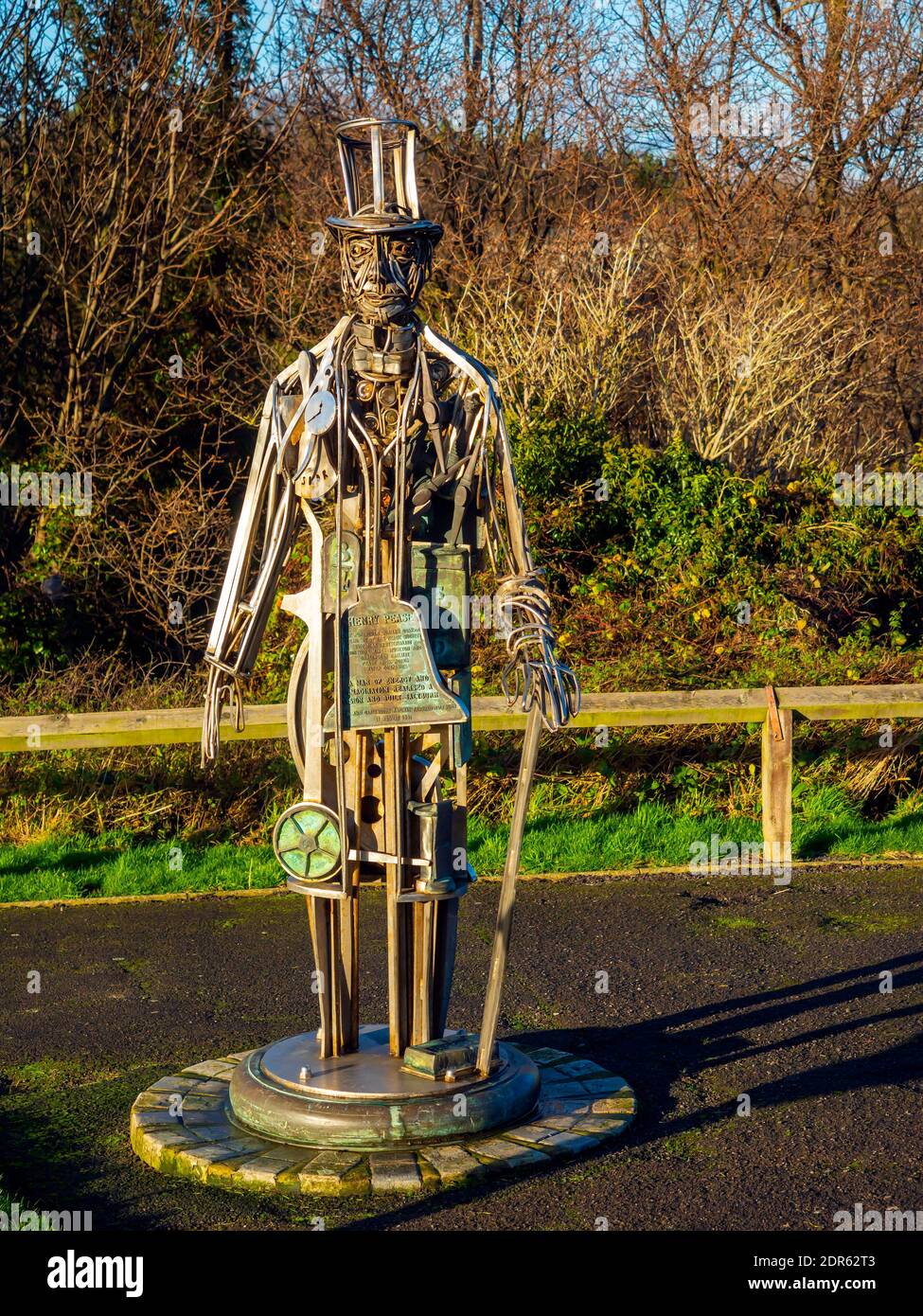 A sculpture made of machine parts representing Henry Pease prominent Quaker Victorian business man and founder of Saltburn in autumn light with trees Stock Photo