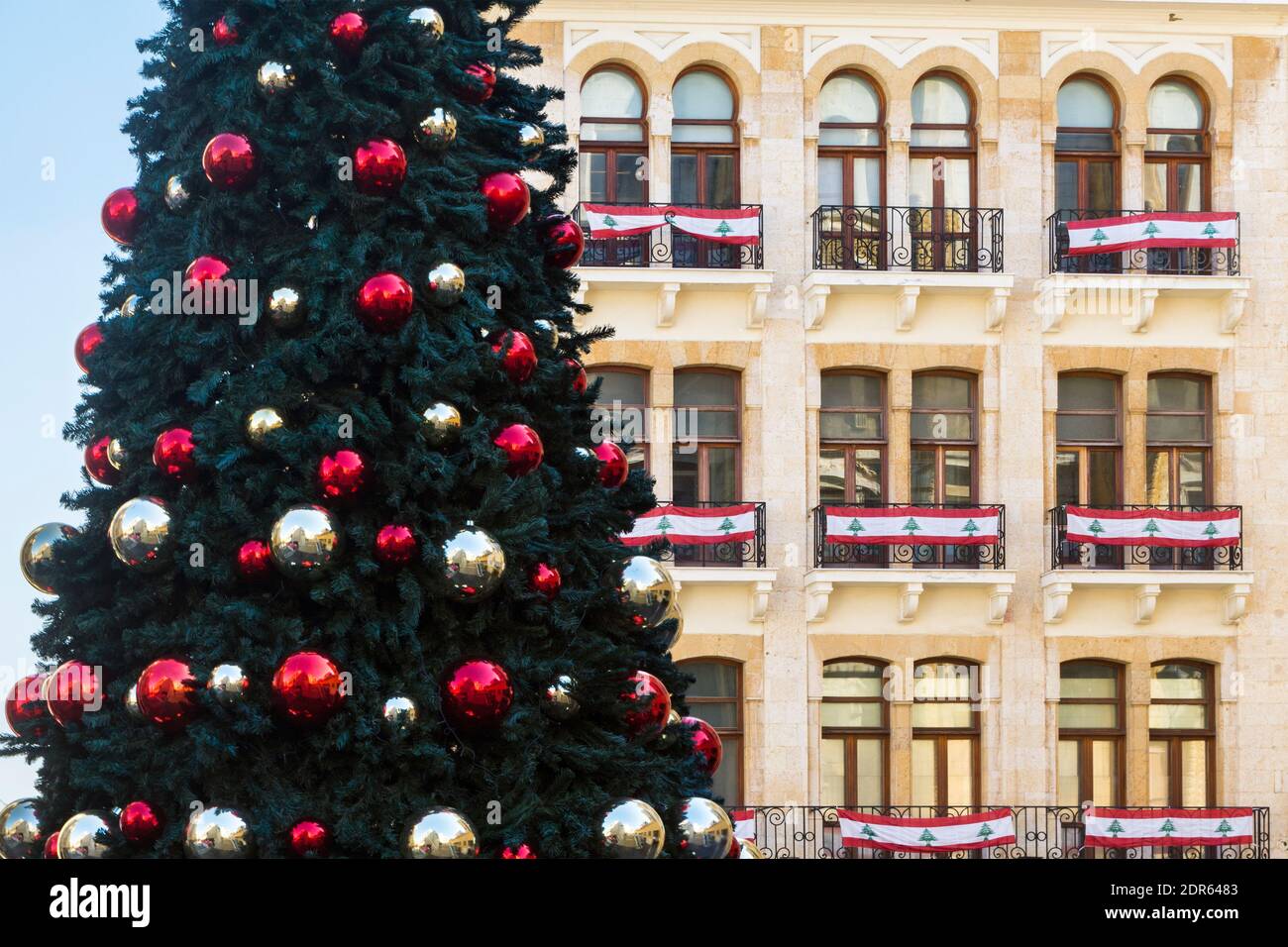 Christmas tree and building with Lebanese flags in downtown Beirut