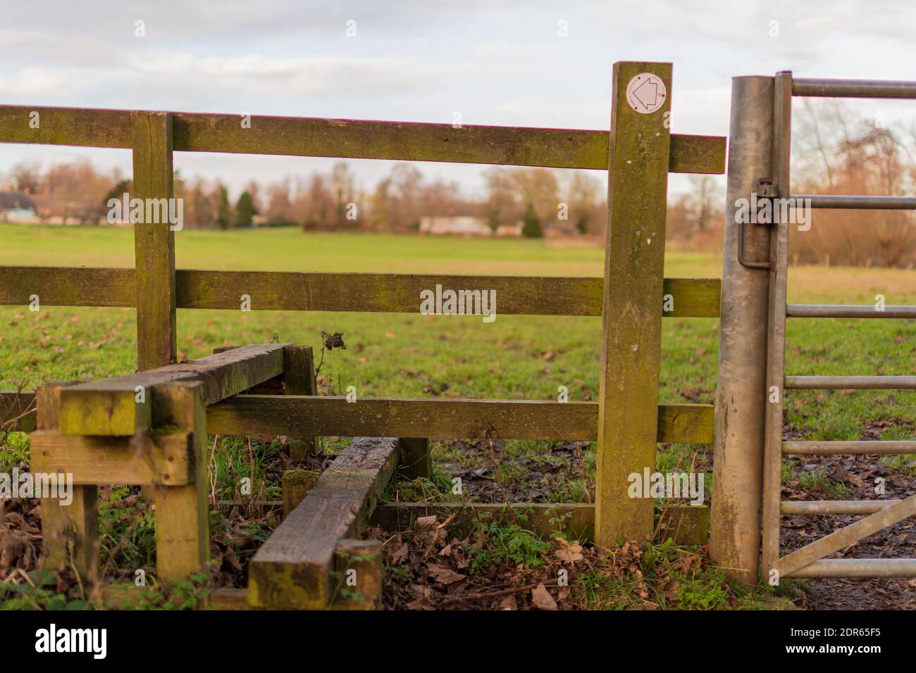 A stile at the beginning of a winter walk Stock Photo