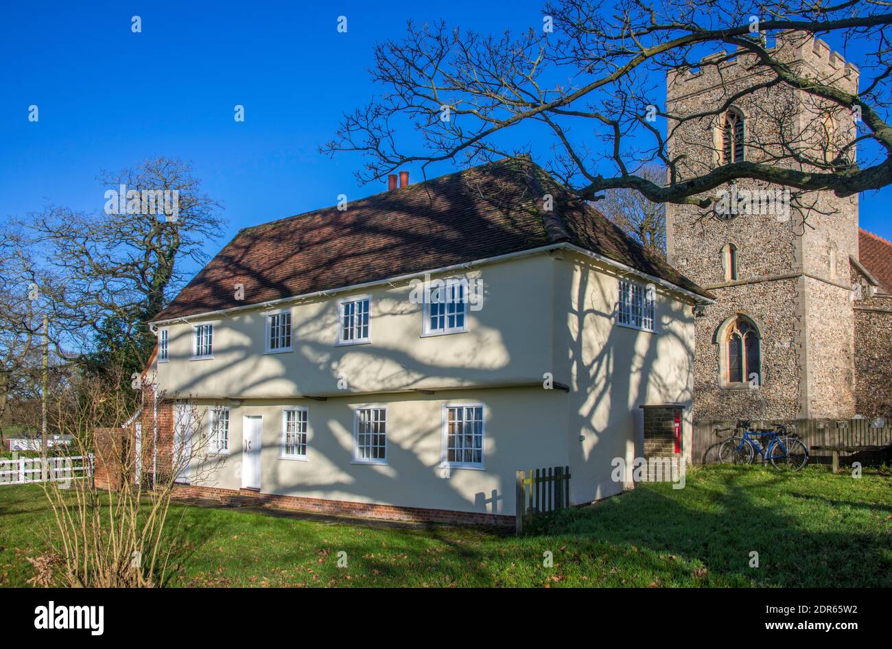 Picturesque 15th century Marriage feasting hall and clock tower Saint Mary's Church, Matching Church Village Essex England Stock Photo