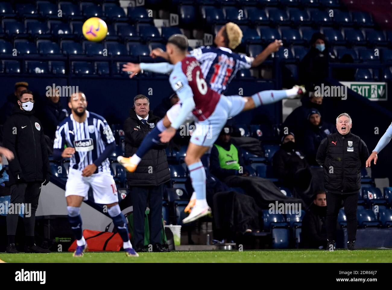 West Bromwich Albion manager Sam Allardyce and assistant Sammy Lee (right) watch the action during the Premier League match at The Hawthorns, West Bromwich. Stock Photo