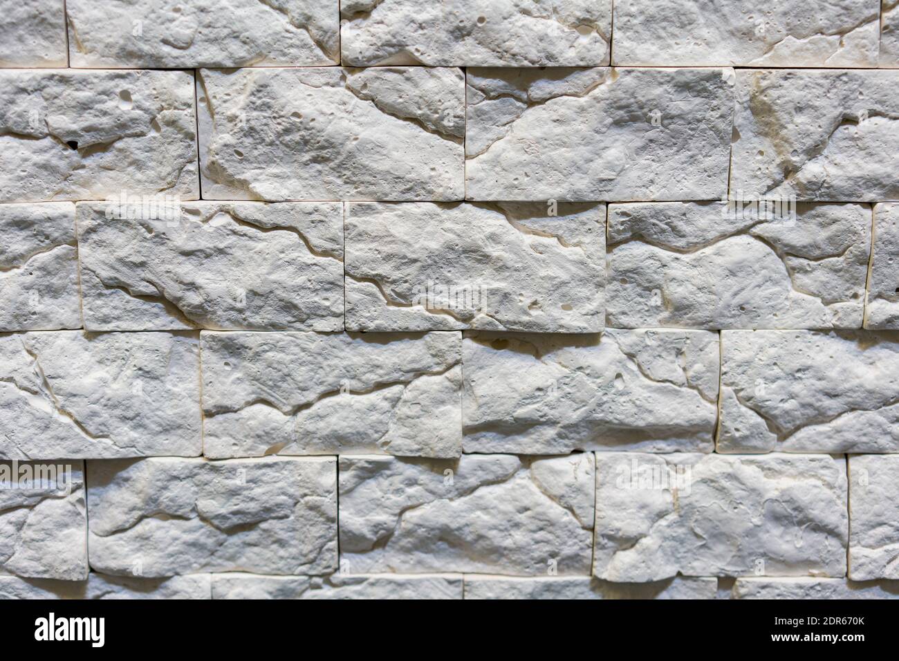 Seamless texture of white decorative stacked stone, natural stone cladding.  brick background. close up. Background. toned Stock Photo - Alamy