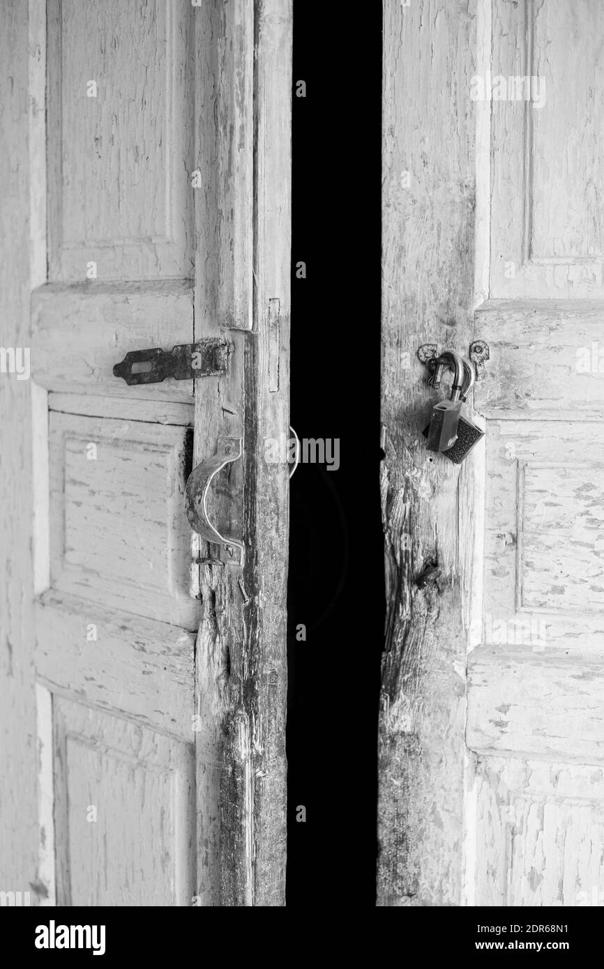 Old wooden door to the barn. History and retro. Construction and