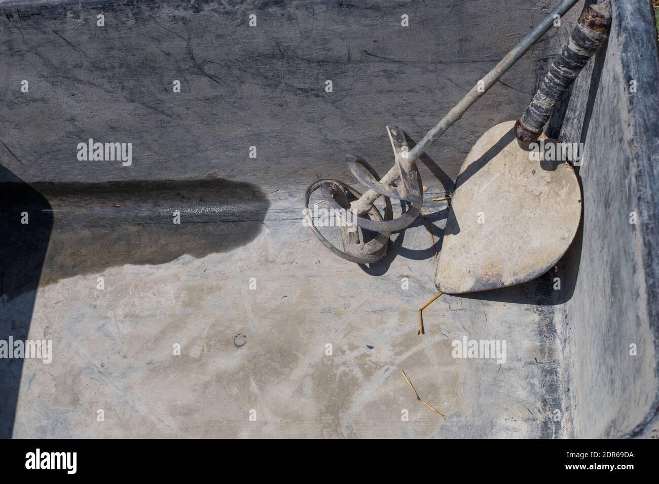 Tools for diluting cement and masonry mortar. Repair and construction
