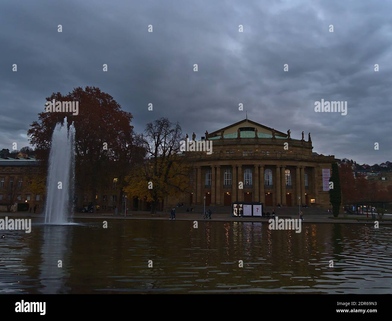 Front view of historic opera house of Stuttgart, Baden-Wuerttemberg, Germany, venue of Staatsoper and Ballet, on the shore of small lake with fountain. Stock Photo
