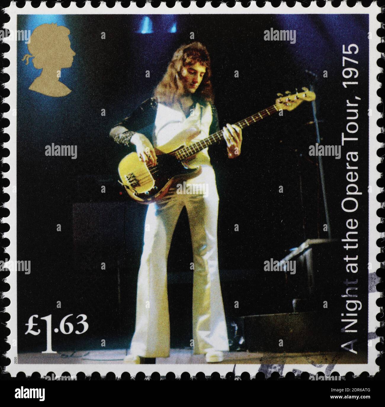 John Deacon in concert with the Queen on stamp Stock Photo