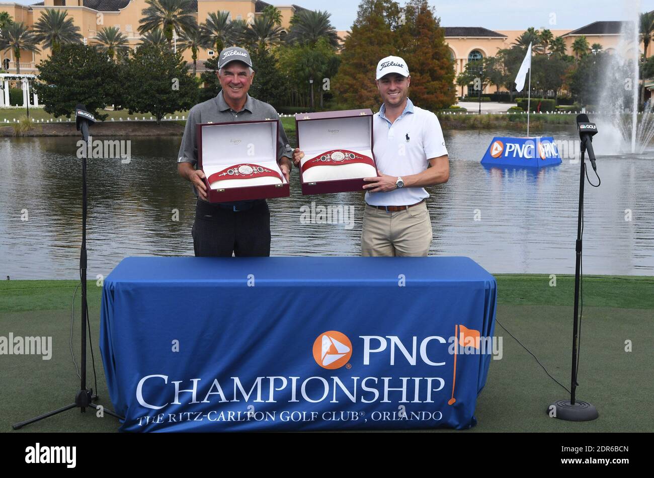 Orlando, United States. 20th Dec, 2020. December 20, 2020 - Orlando, Florida, United States - Justin Thomas (right) and his father, Mike, pose with the Willie Park trophy after winning the 2020 PNC Championship golf tournament at the Ritz-Carlton Golf Club on December 20, 2020 in Orlando, Florida. The team shot 25 under for the tournament and 15 under during Sunday's second round. Credit: Paul Hennessy/Alamy Live News Stock Photo