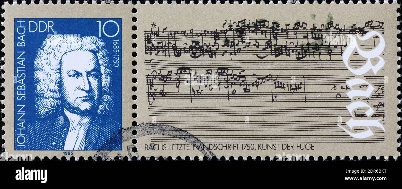 Original sheet music by Johan Sebastian Bach on postage stamp Stock Photo