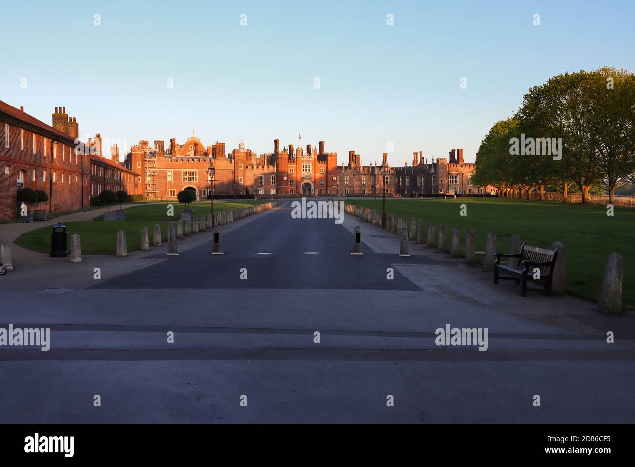 Red brick Tudor Facade of Hampton Court Palace as the sun sets Stock Photo
