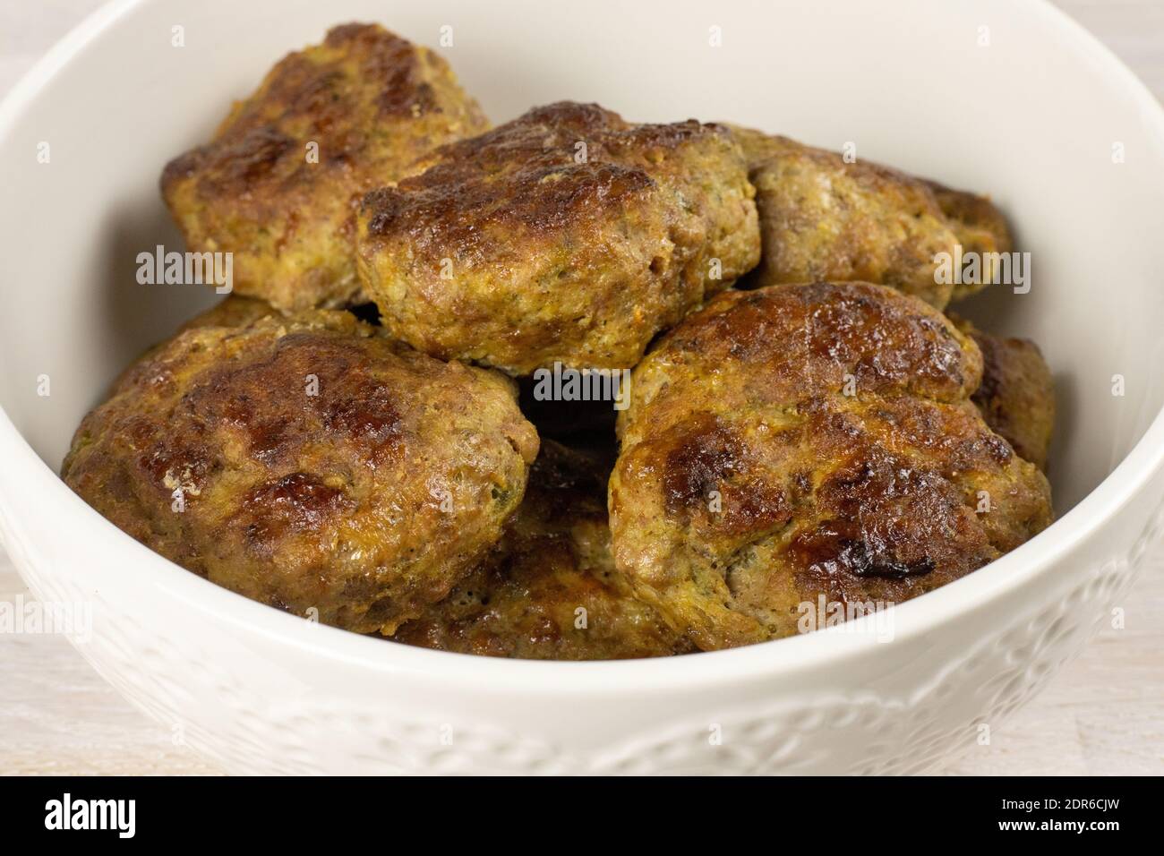 Homemade meat beef burger patties cutlet heap on white plate table