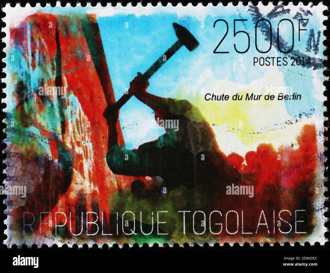 The fall of Berlin wall on stamp of Togo Stock Photo