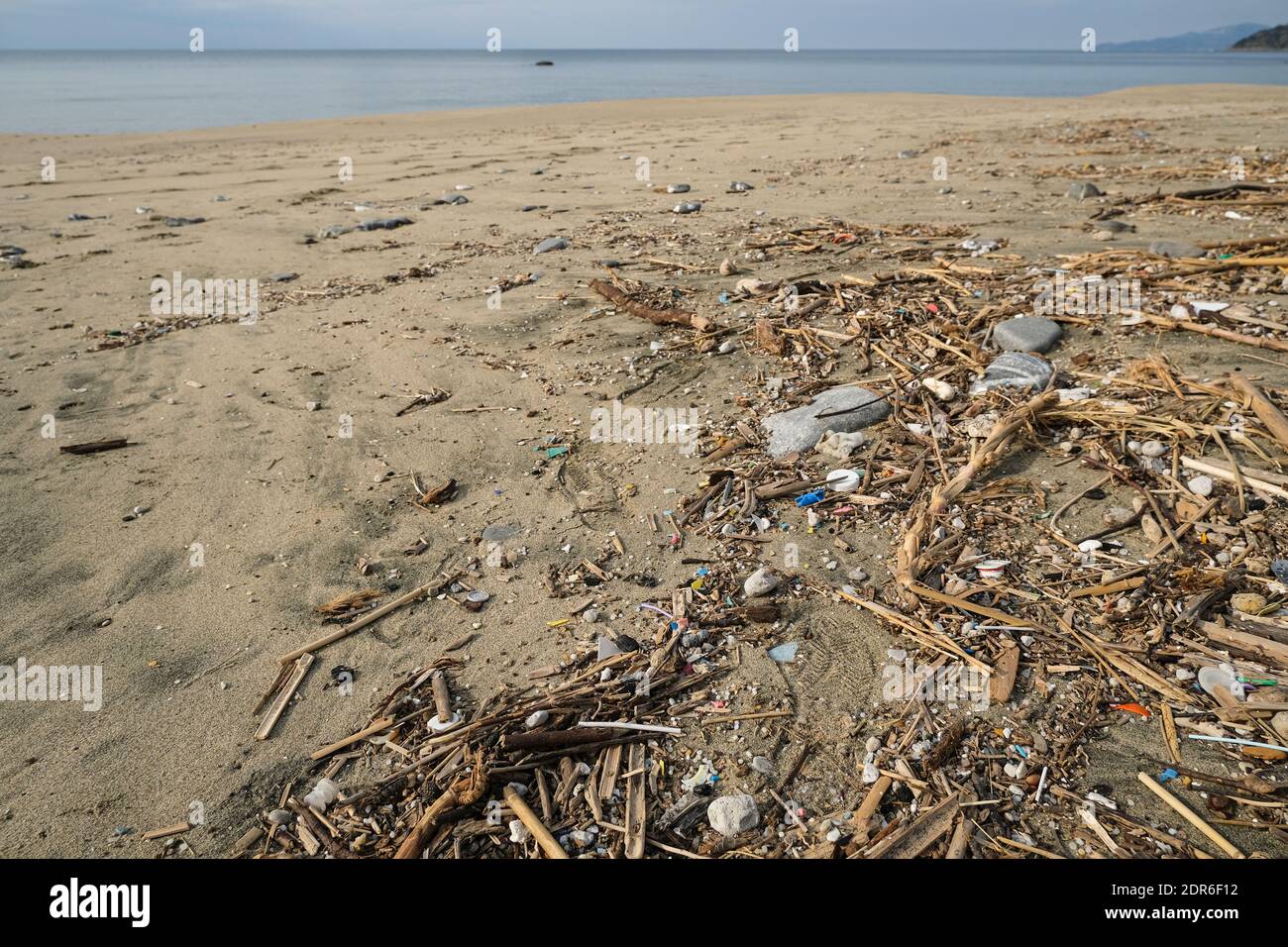Micro Plastic waste dump on ocean sea coast,polluted ecosystem after a