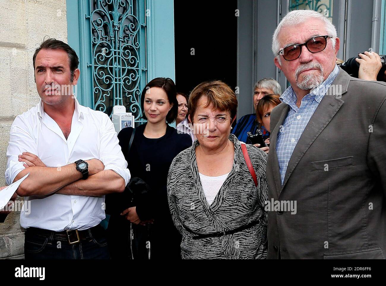 File : French actor Jean Dujardin along with his companion former ice  dancer Nathalie Pechalat and his parents inaugurates 'Cinema Jean Dujardin',  the first movie theatre carrying his name, in his home
