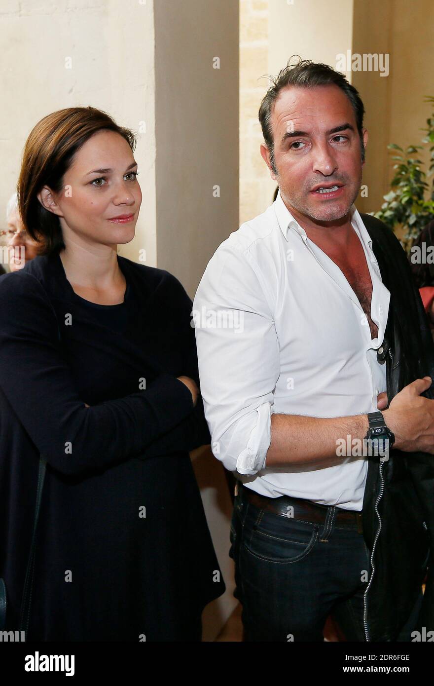File : French actor Jean Dujardin along with his companion former ice  dancer Nathalie Pechalat and his parents inaugurates 'Cinema Jean Dujardin',  the first movie theatre carrying his name, in his home