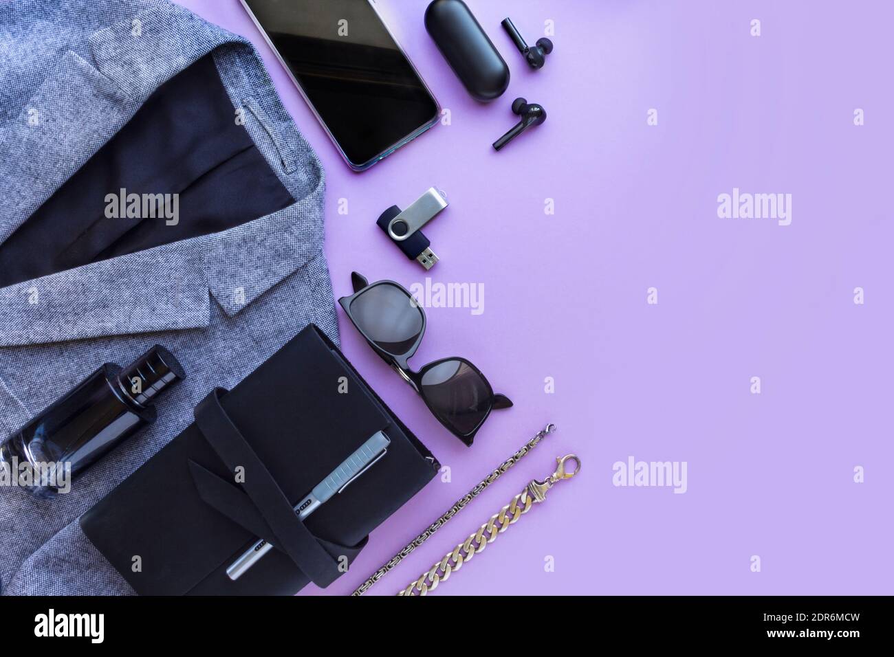 Men's accessories, notebook, airpods, sunglasses, car model on lilac  background. Top view, flat lay Stock Photo - Alamy