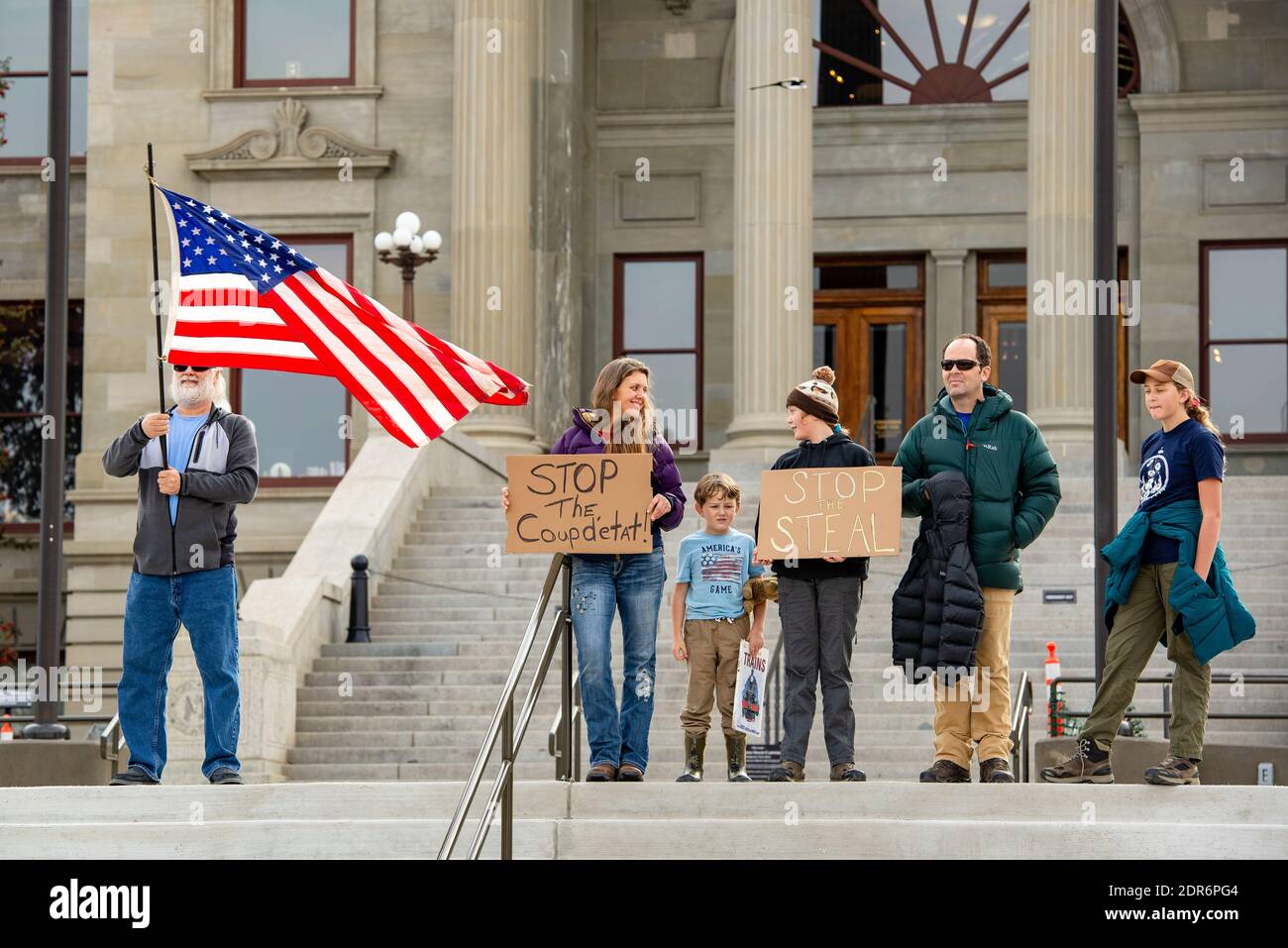 Helena, Montana - Nov 7, 2020: Family protests at Stop the Steal rally, perceive election was stolen from Donald Trump by Joe Biden, holding sign Stop Stock Photo