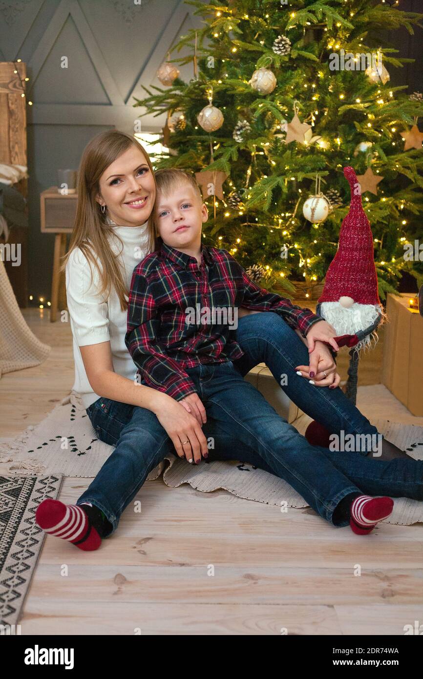 Beautiful family with christmas tree in the living room Stock Photo