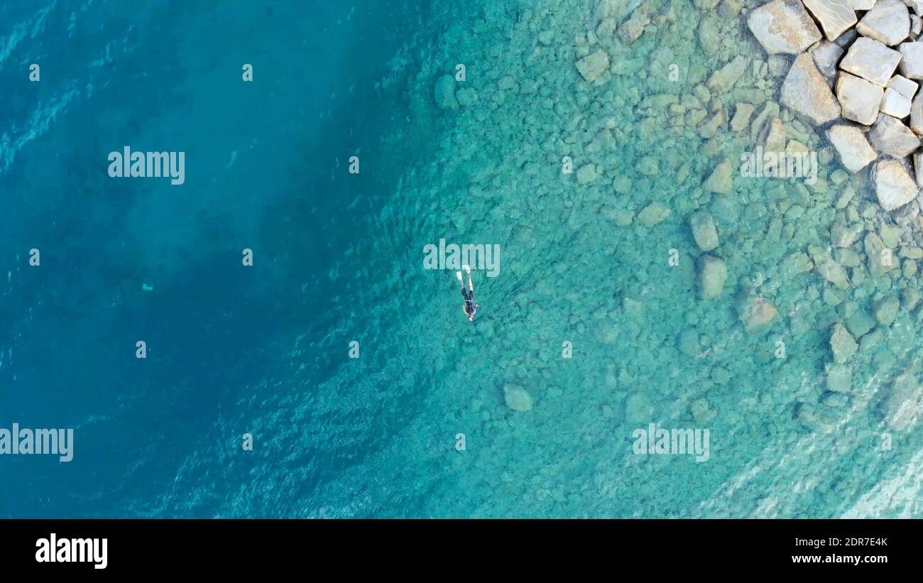 Aerial one man swimming sea hi-res stock photography and images - Alamy