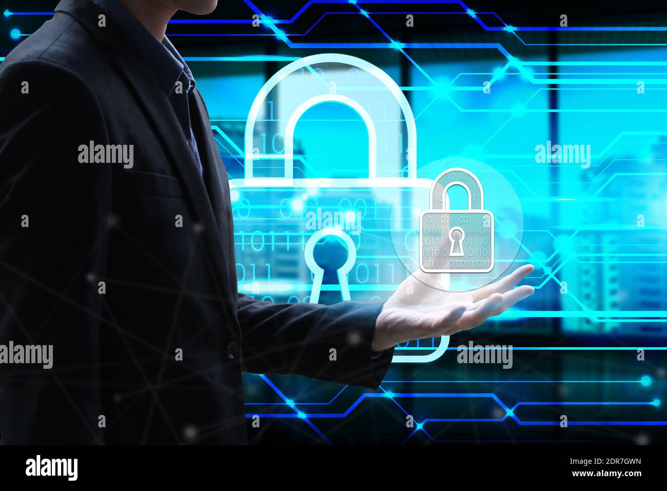 Midsection Of Businessman Holding Lock Icon Against Cyberspace Stock Photo