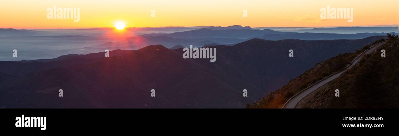 Mountain road with spectacular views of mountain ranges with sunset or sunrise, panoramic view. Montseny, Montserrat, Turo de l'Home, Barcelona, Catal Stock Photo