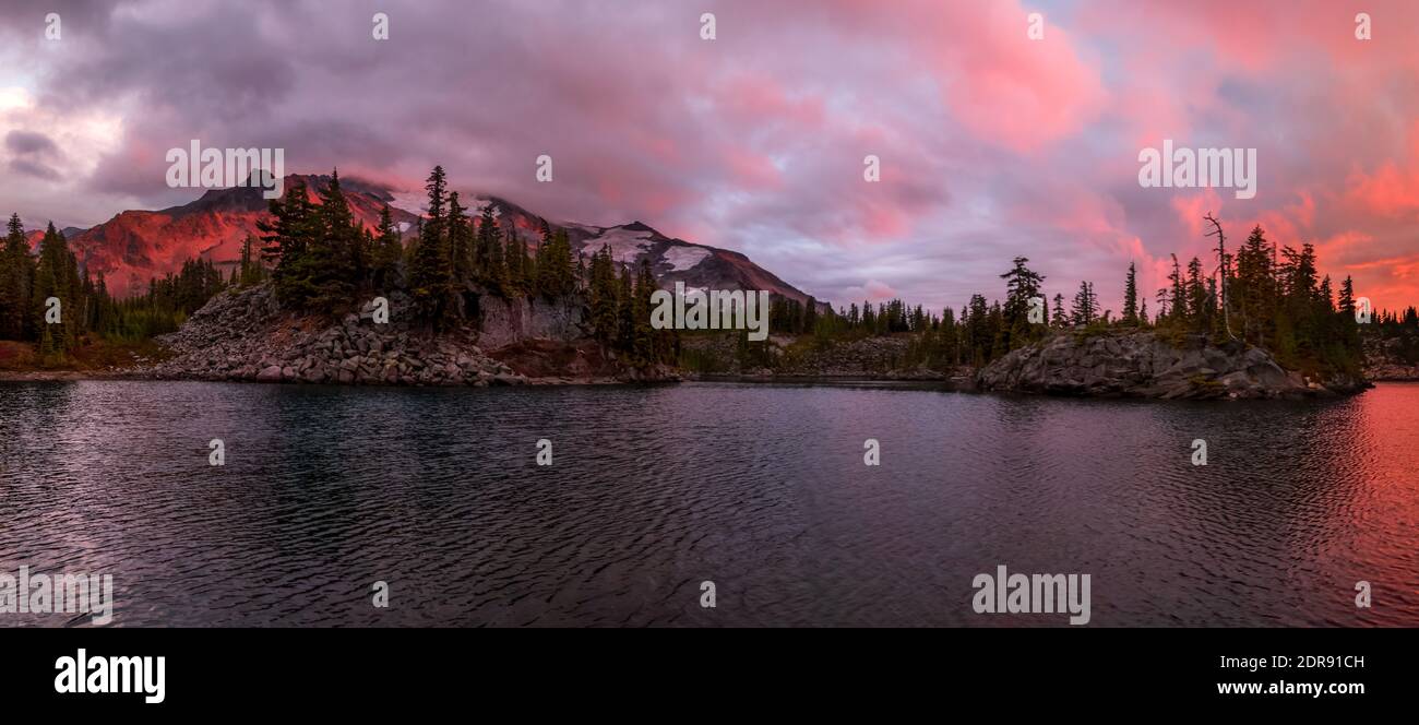Dramatic sunset at Bays Lake in Oregon's Mt Jefferson Wilderness with Mt Jefferson in the background Stock Photo