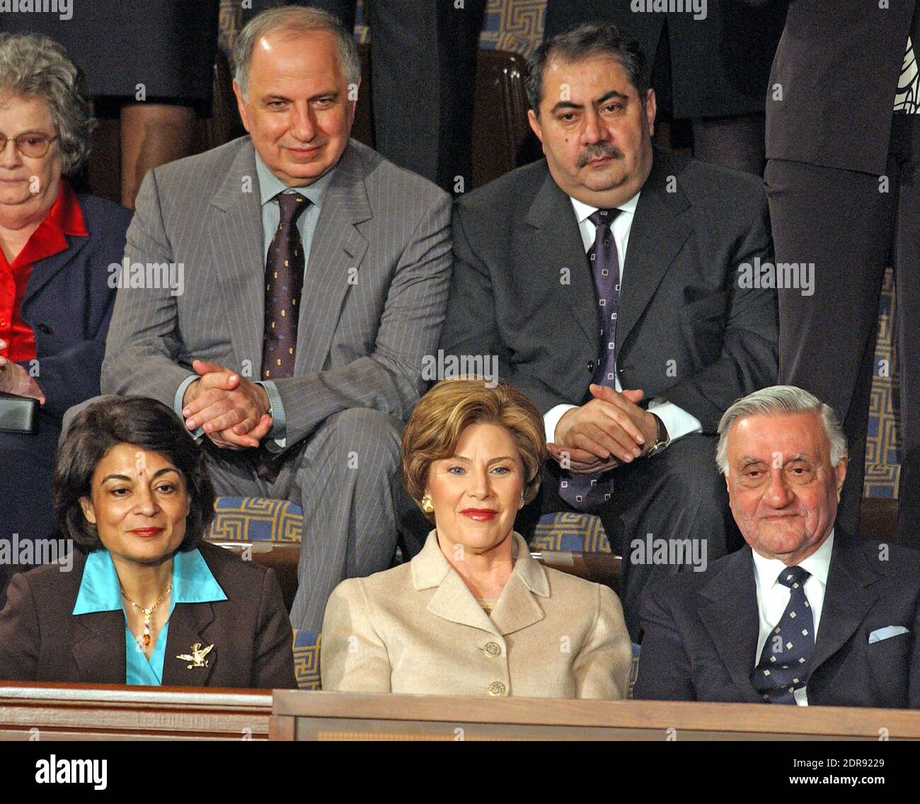 In this file photo from January 20, 2004, first lady Laura Bush sits with invited guests from the Iraqi Governing Council for her husband, United States President George W. Bush's 2004 State of the Union Address to a Joint Session of the United States Congress at the Capitol in Washington, D.C. on January 20, 2004. Left to right in the top row: Doctor Ahmed Chalabi, Iraqi Governing Council; and Hoshyar Zebari, Iraqi Interim Foreign Minister. Left to right on the bottom row: Ms. Rend al-Rahim, Iraqi Senior Diplomatic Representative; first lady Laura Bush; and Doctor Adnan Pachachi, President, I Stock Photo
