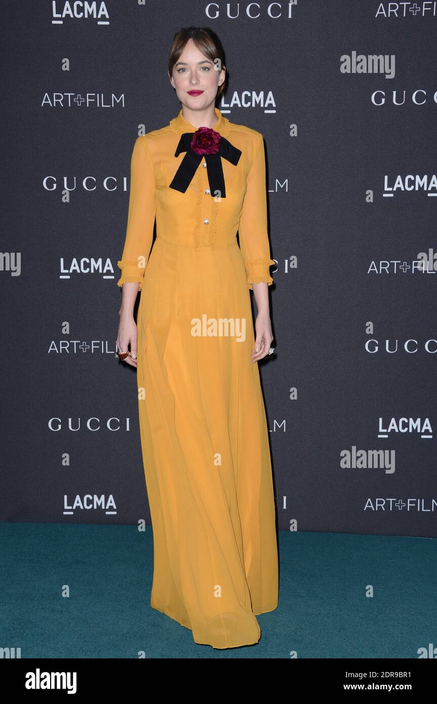 Dakota Johnson (wearing Gucci dress) attends LACMA 2015 Art+Film Gala