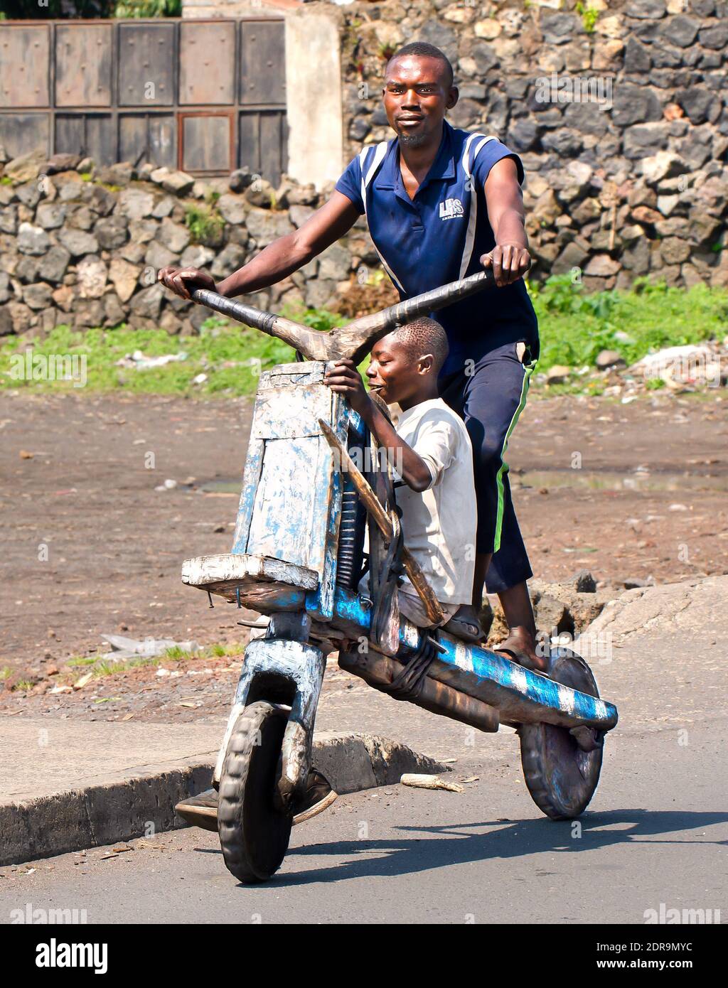 Wooden scooters in the image are called chukudu. They are common sight in Goma, North Kivu, Democratic Republic of Congo Stock Photo