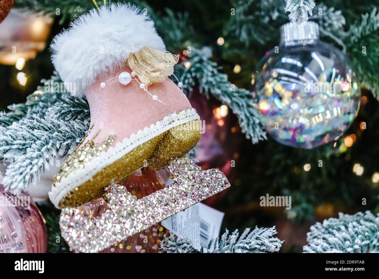 Close-up of a Christmas tree decorated with pink toys Stock Photo