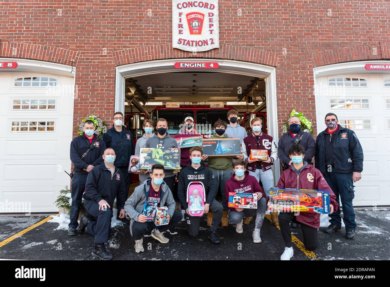 Concord, Massachusetts. 18th December, 2020. Concord-Carlisle Highschool Football Team donating to Concord Firefighters Relief Association Toy Drive Stock Photo
