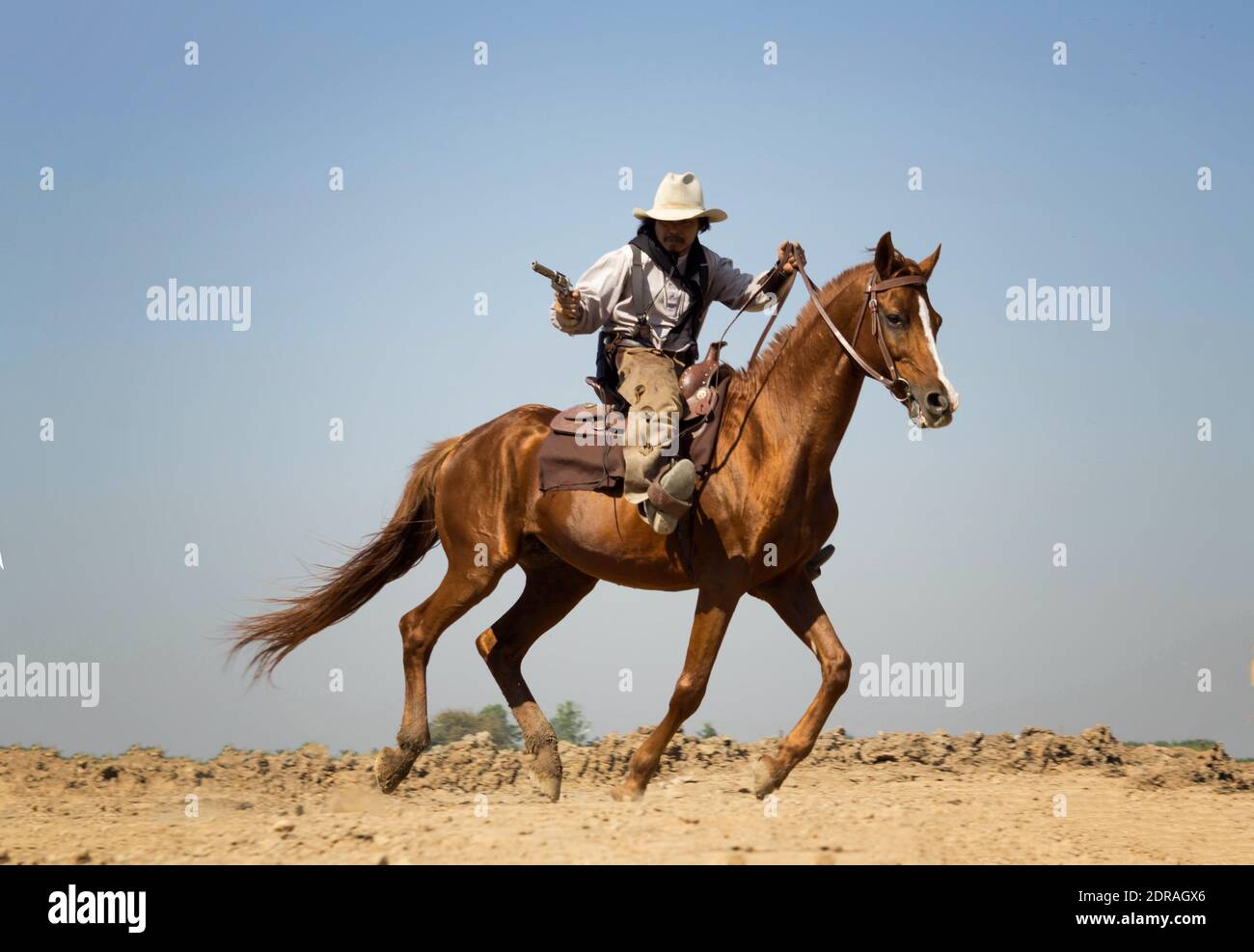Cowboy Riding Horse Gun High Resolution Stock Photography and Images Alamy