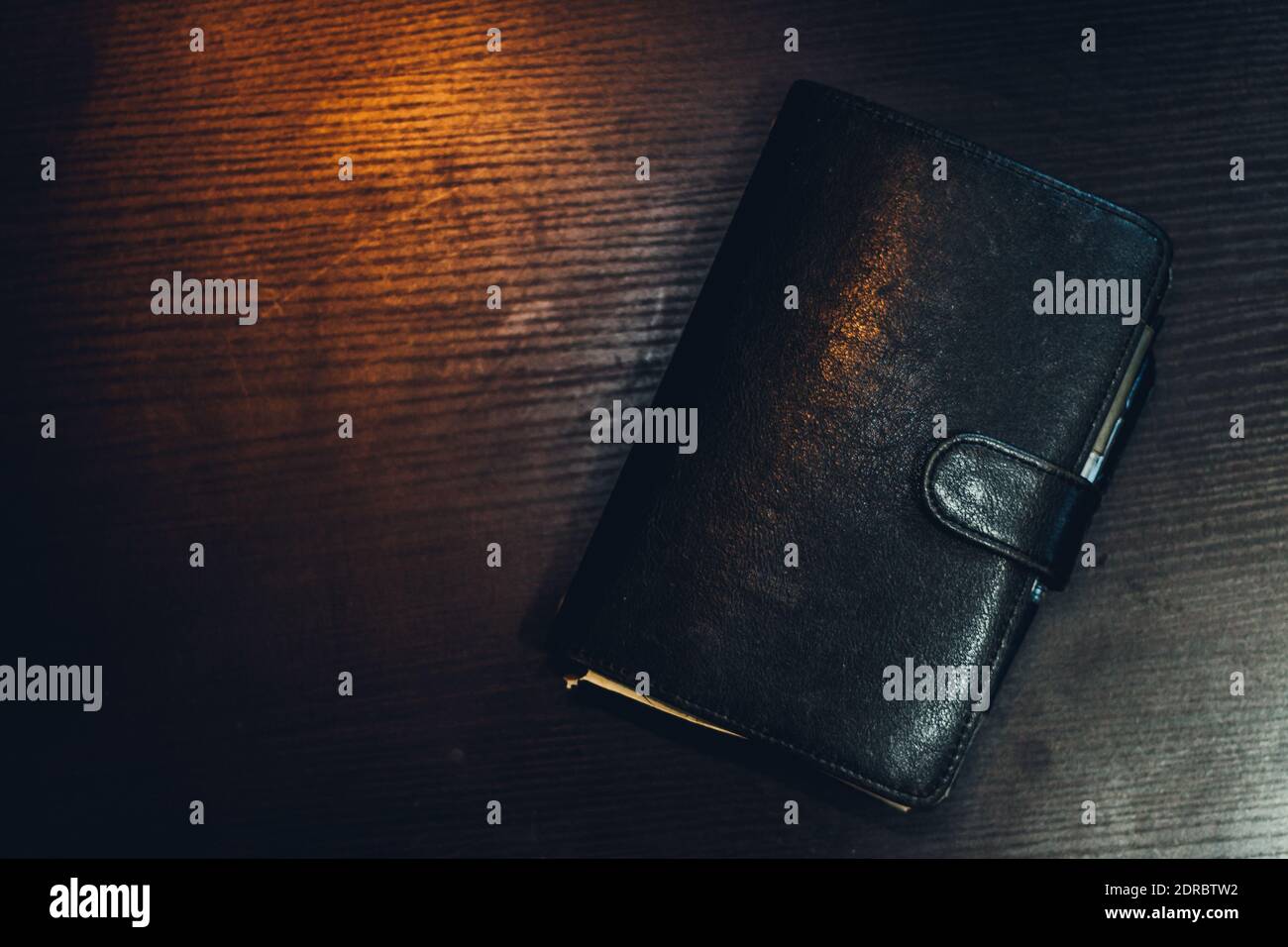 Directly Above Shot Of Closed Leather Diary On Table Stock Photo