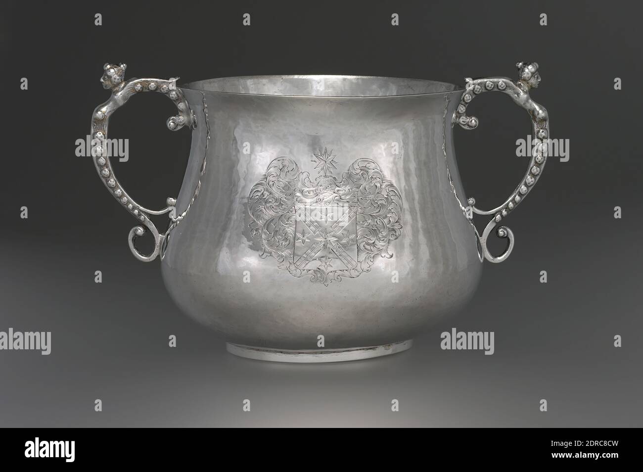 Maker: Gerrit Onckelbag, American, 1670–1732, Caudle Cup, Silver, 5 3/4 × 9 3/8 in., 50.71 lb. (14.6 × 23.8 cm, 23 oz.), This two-handled cup made by Gerrit Onckelbag is of a type called in Britain a porringer, posset pot, or caudle cup, more or less interchangeably, indicating that it was used to serve a variety of foodstuffs. Uncommon in New York silver, the form is identical to contemporary cups from England and New England, including an example of 1679–85 by John Coney of Boston Stock Photo