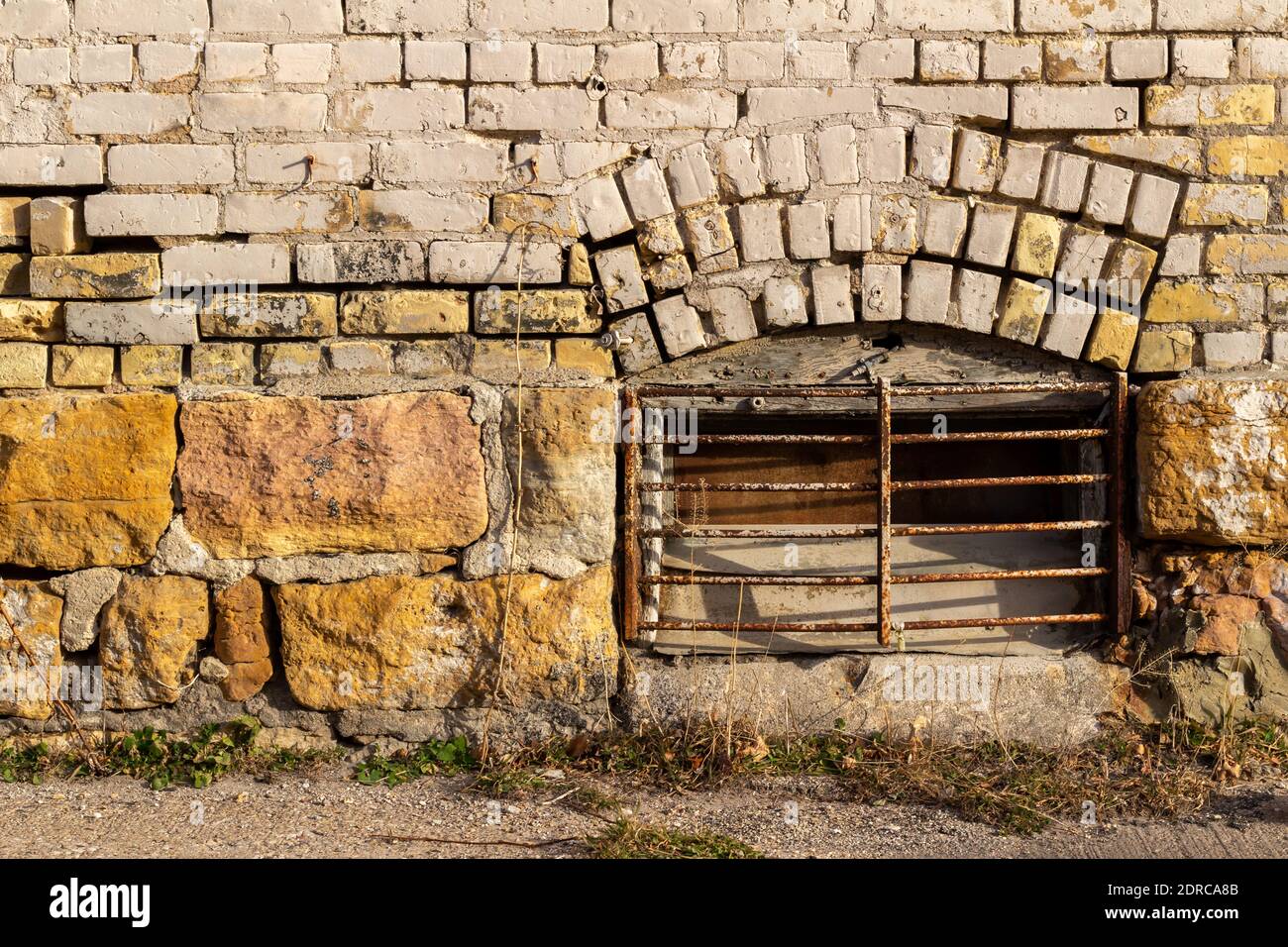 Full frame view of an eroding antique exterior brick wall surface with ...