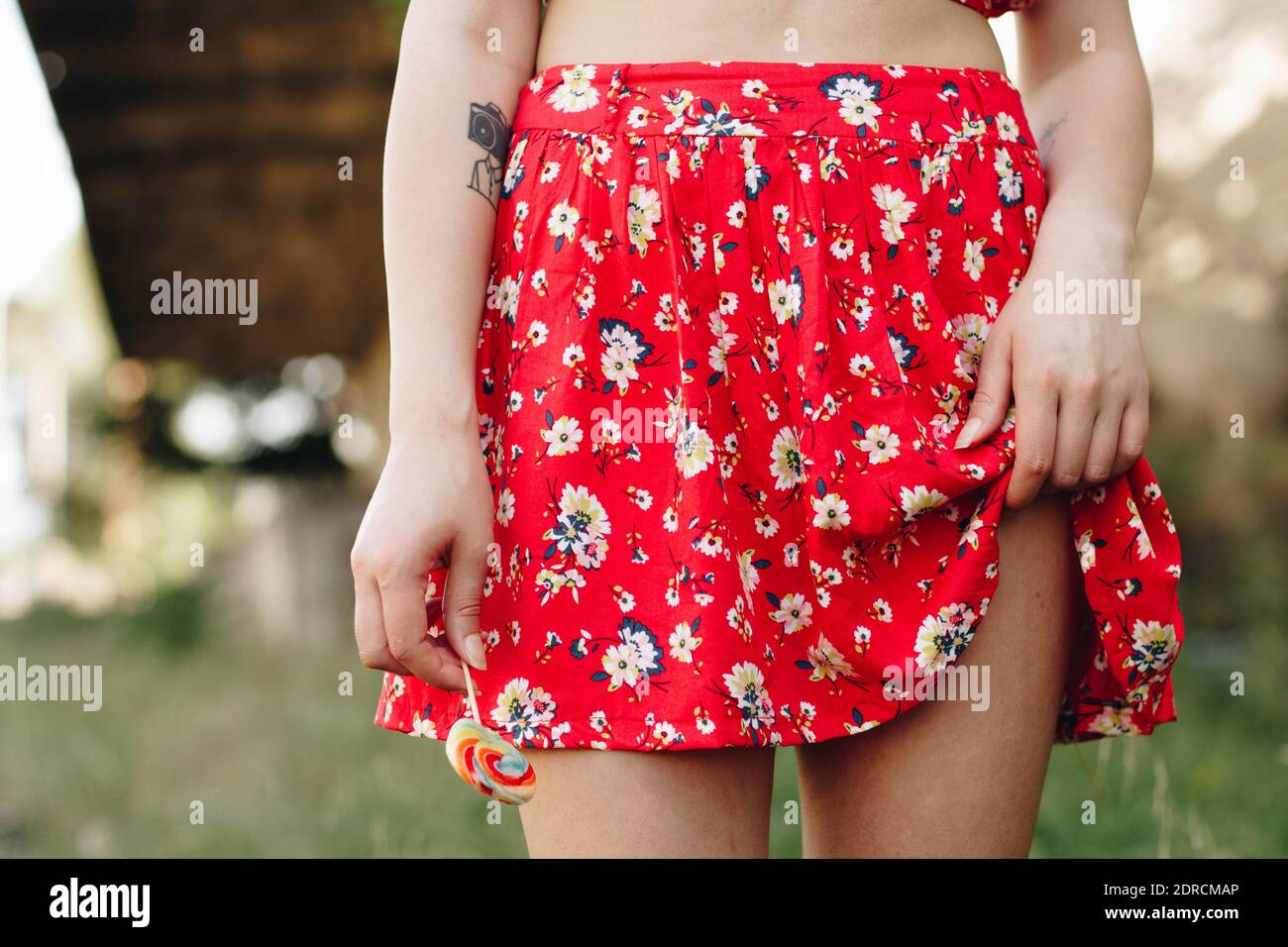 Woman wearing red skirt hires stock photography and images Alamy
