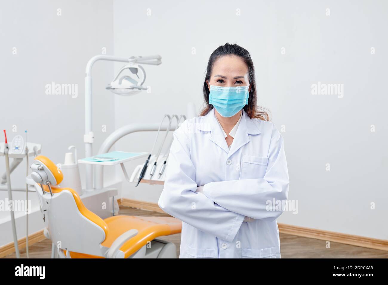 Mature Asian female dentist Stock Photo