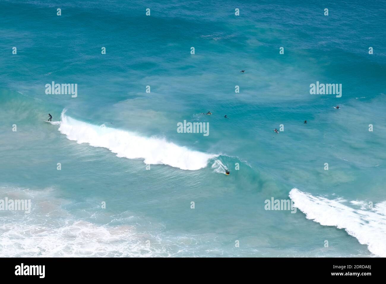 High Angle View Of Surfers In Sea Stock Photo