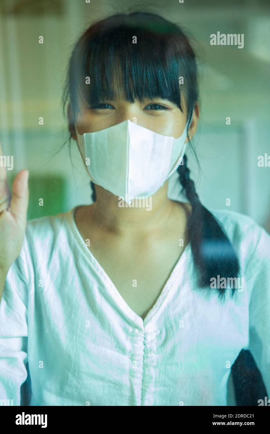 Portrait Of Girl Wearing Mask Stock Photo