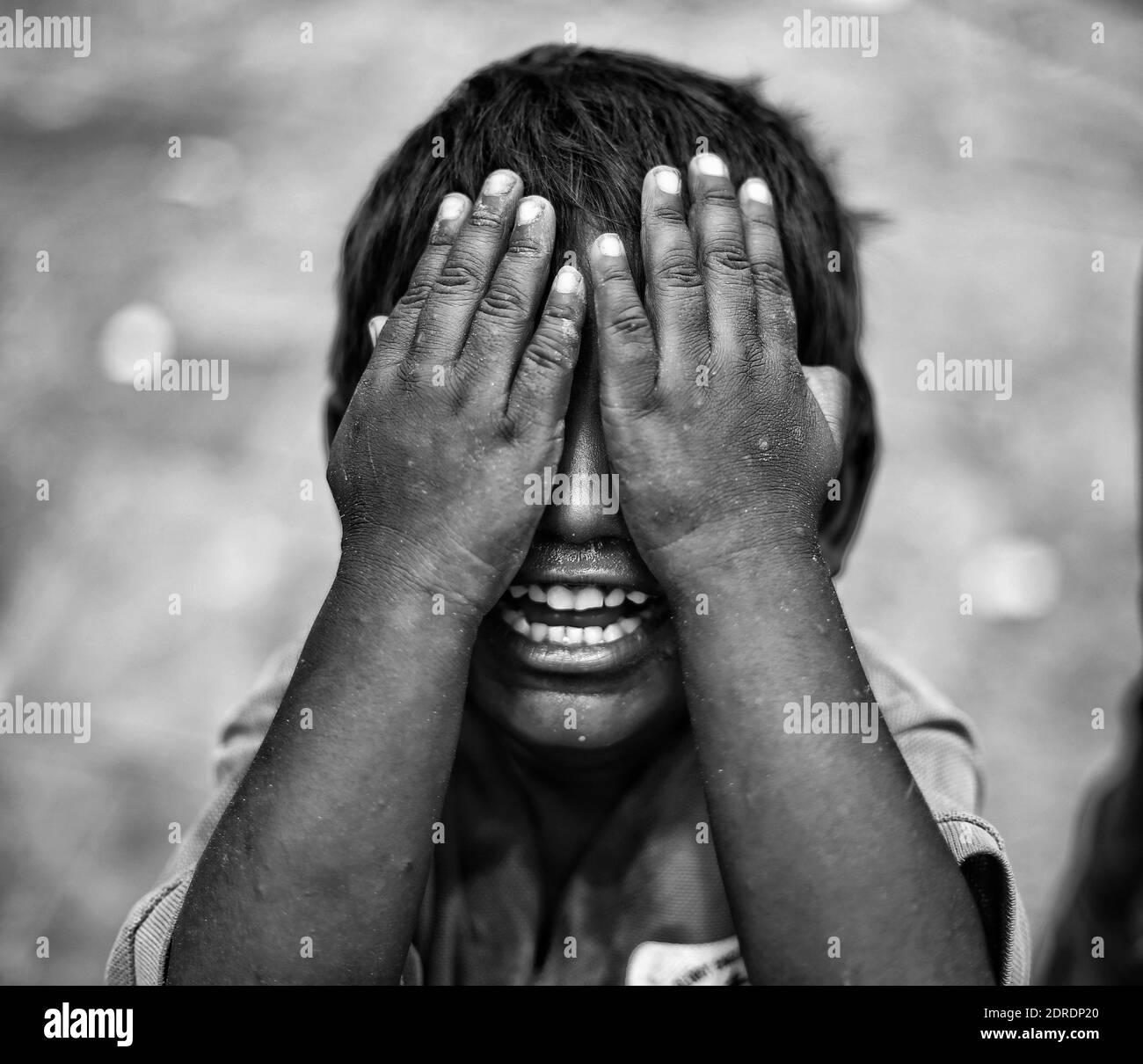 Close-up Of Boy Covering Eyes With Hands Stock Photo - Alamy