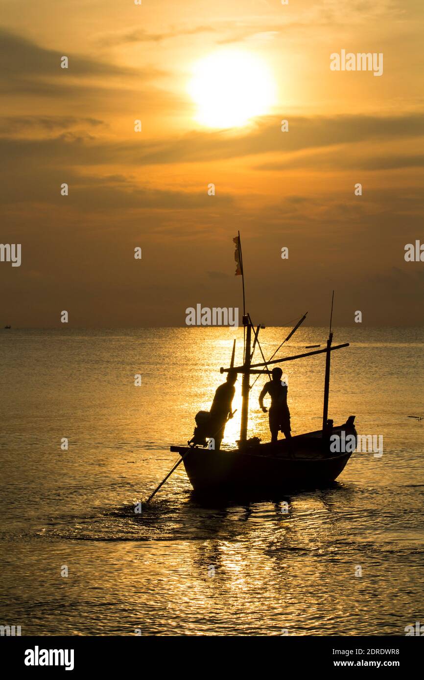 Fisherman silhouette in sea at sunrise , Thailand Stock Photo - Alamy