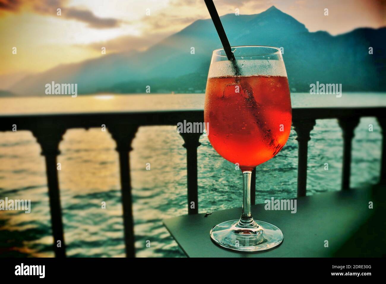 Enjoy a refreshing aperitif in the sunset at lake Como. Stock Photo
