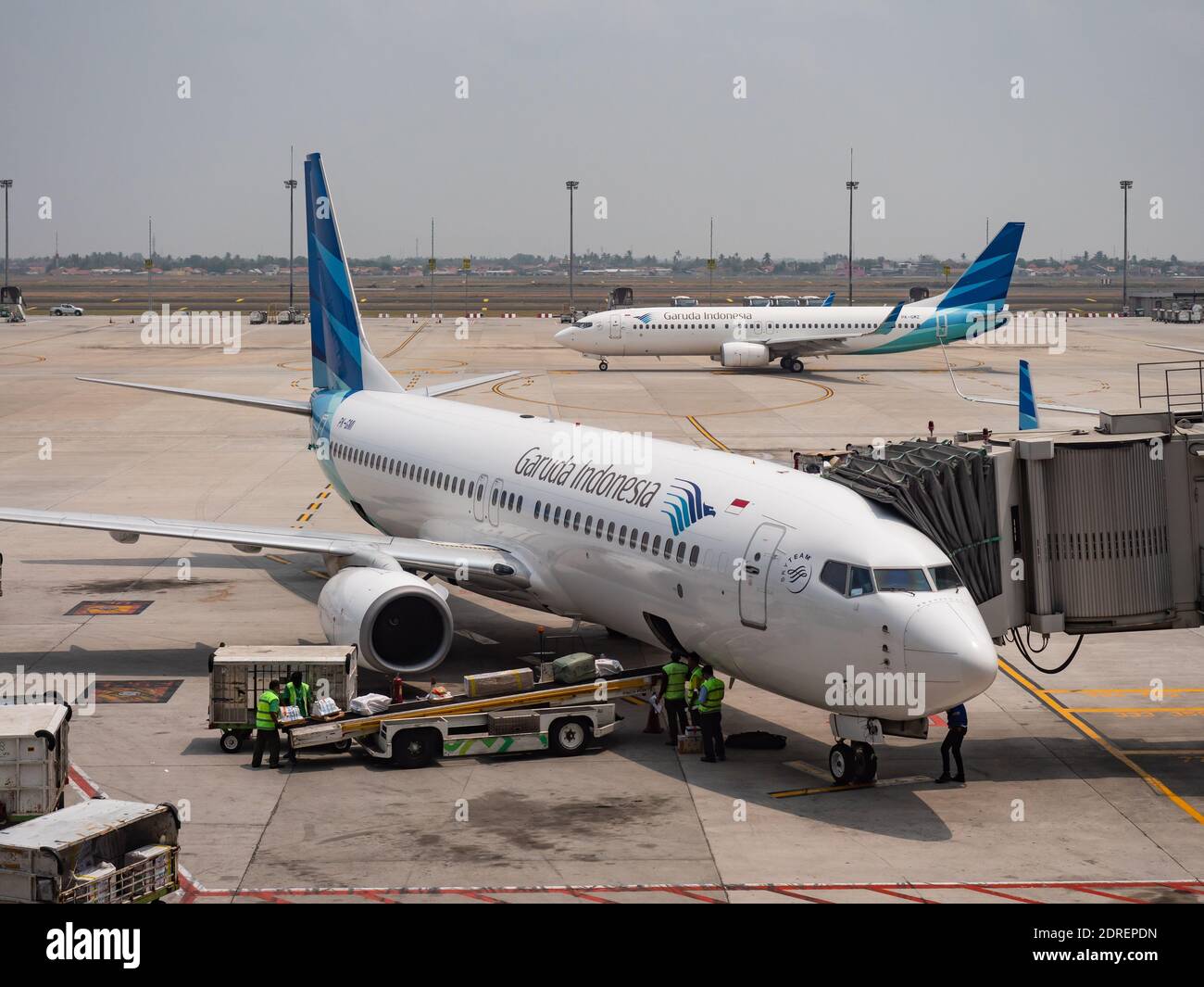 Two Garuda Indonesia Boeing 737 at Terminal 3, Soekarno–Hatta International Airport in Jakarta, Indonesia. Stock Photo