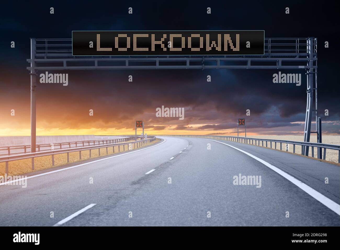 Highway with information board. Caption LOCKDOWN Stock Photo