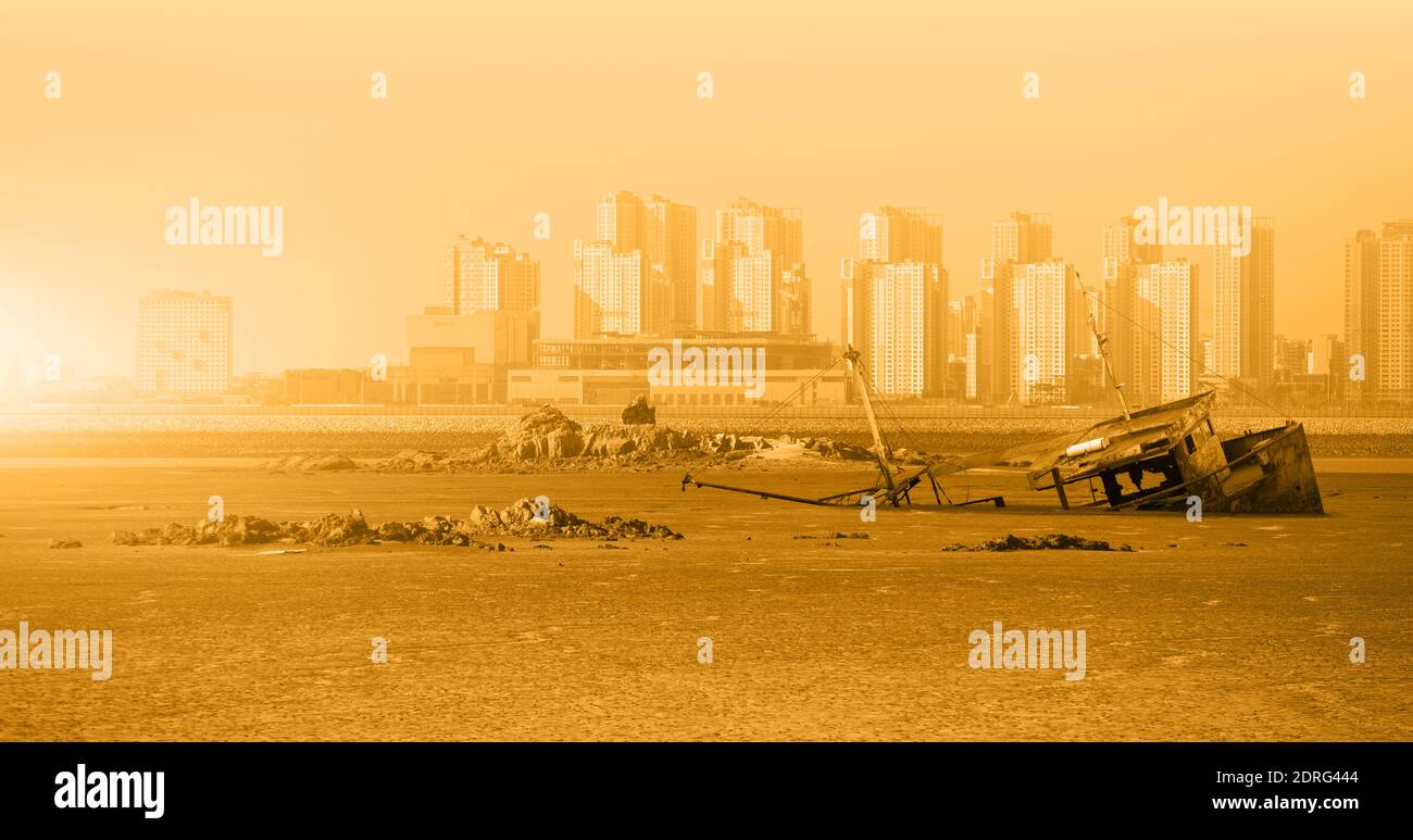 Rusty ship in a dried ocean. Concept of global warming and climate change Stock Photo