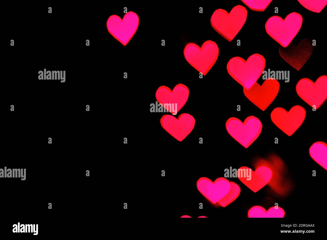 Red and pink heart bokeh background Stock Photo - Alamy